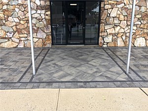 nicolock granite city alpine contemporary front entrance with double border raven 18x18